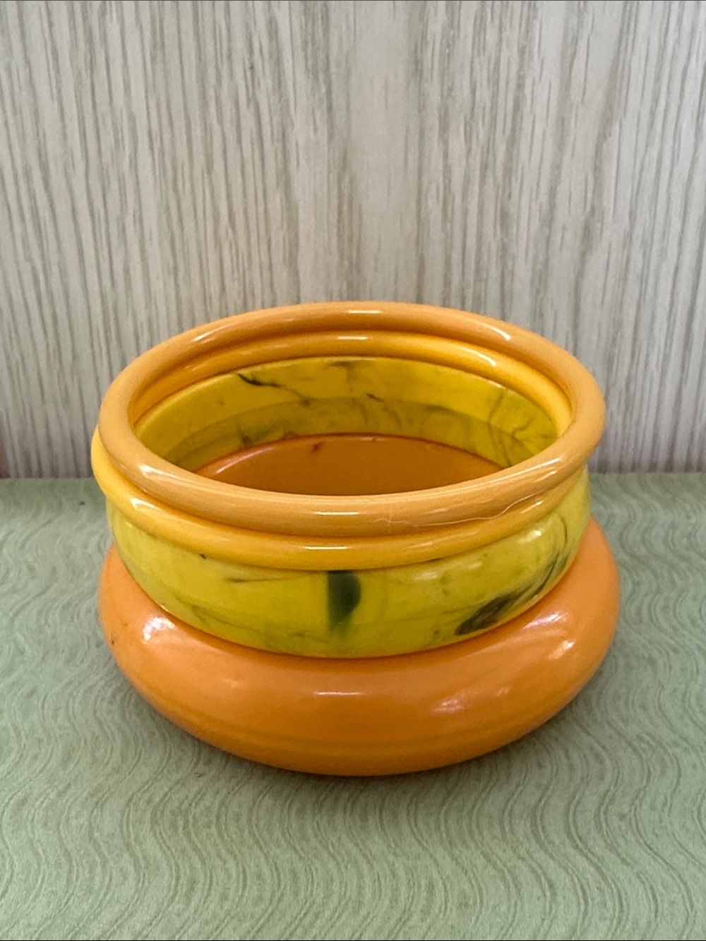 Set of Four Vintage Orange and Yellow Lucite Bangle Bracelets